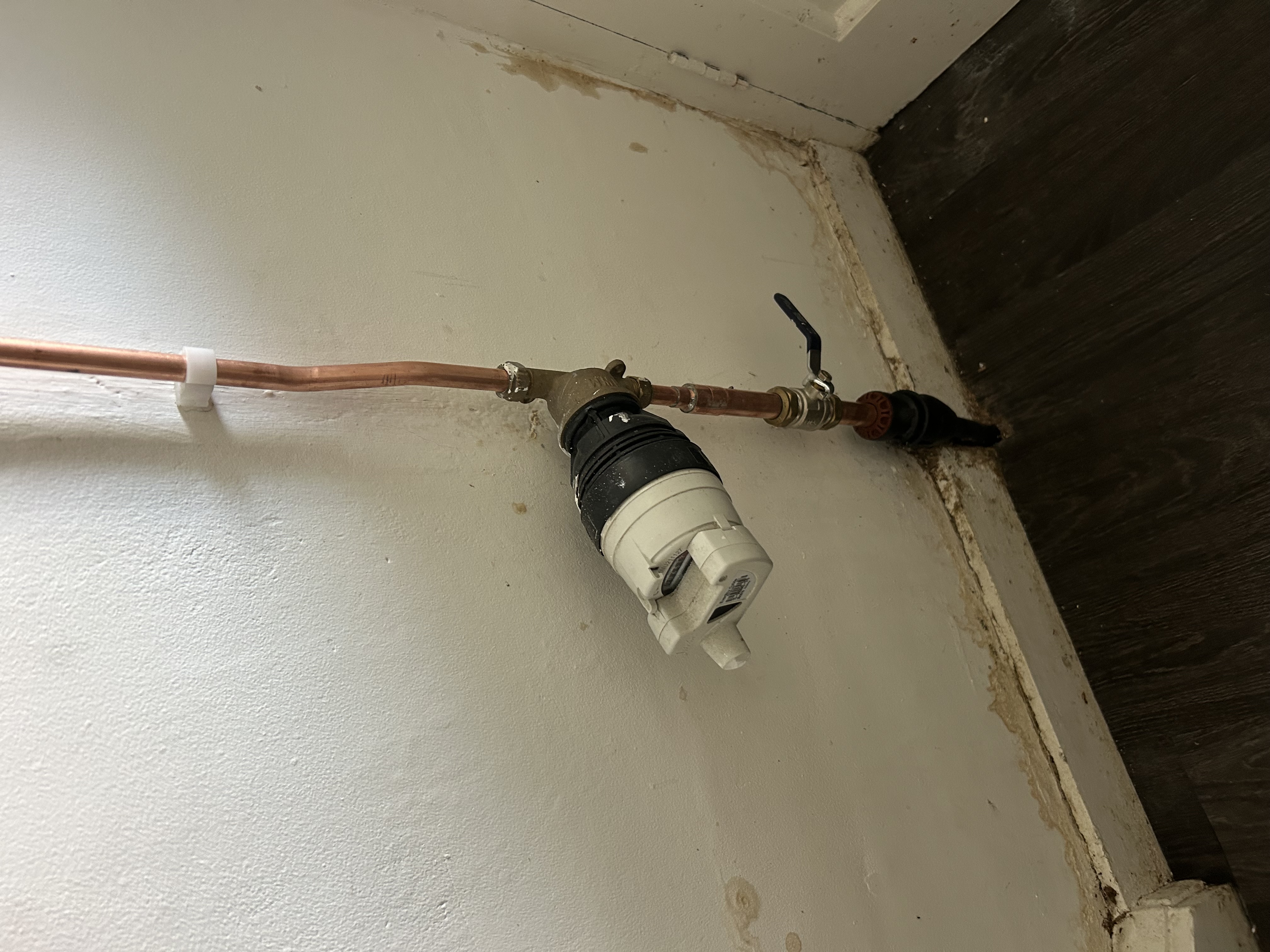 Finished plumbing install with clean tiling